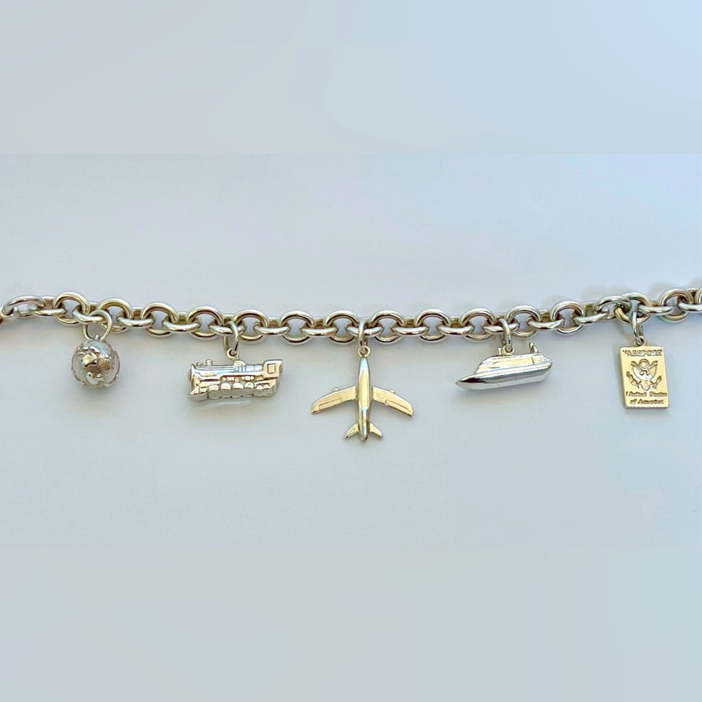 Tiffany & Co Sterling Silver 5 Travel Charms bracelet. Size medium.